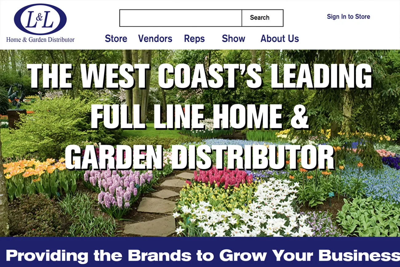 The L&L Supply homepage: the L&L Home & Garden Distributor logo above a Store, Vendors, Reps, Show and About Us menu, over a densely planted spring garden photograph headlined &ldquo;The West Coast&rsquo;s leading full line home & garden distributor&rdquo;, with a blue band below reading &ldquo;Providing the brands to grow your business&rdquo;.