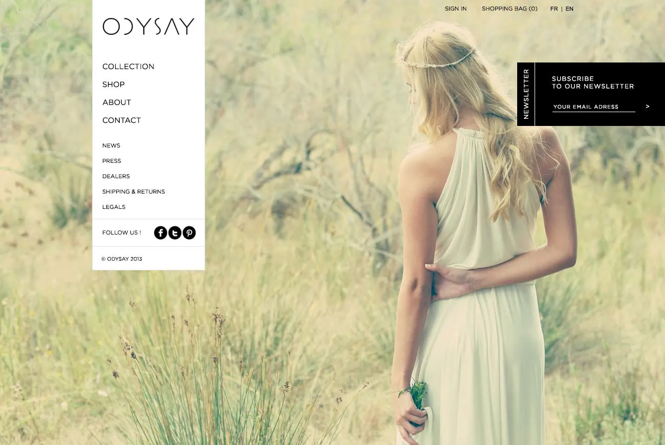 The OdySay storefront: a soft-focus photograph of a woman in a pale green halter gown standing in tall grass, with a white sidebar carrying the ODYSAY wordmark and a Collection, Shop, About, Contact menu, and a black newsletter panel in the upper right.